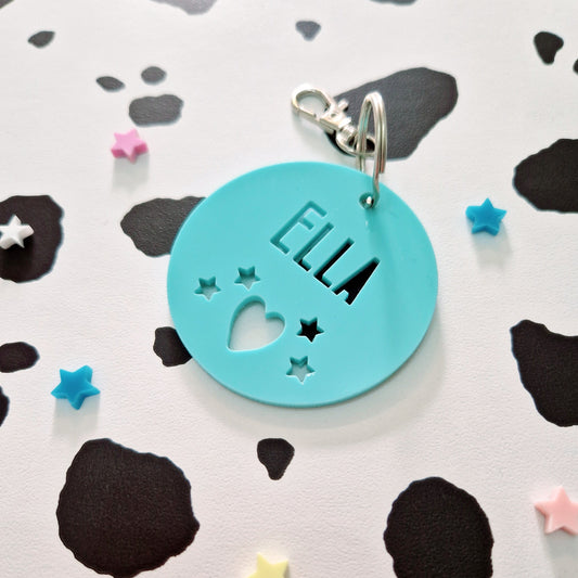 Circular Acrylic Personalised Keyring with heart and star cut outs. School bag keyring.