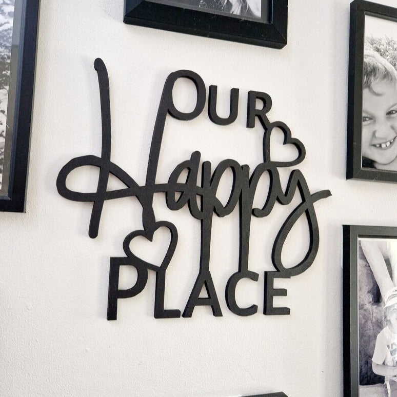 Black wall quote 'Our Happy Place'